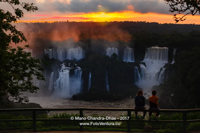 Iguacu, Brazil - tourists watch sunset over the falls