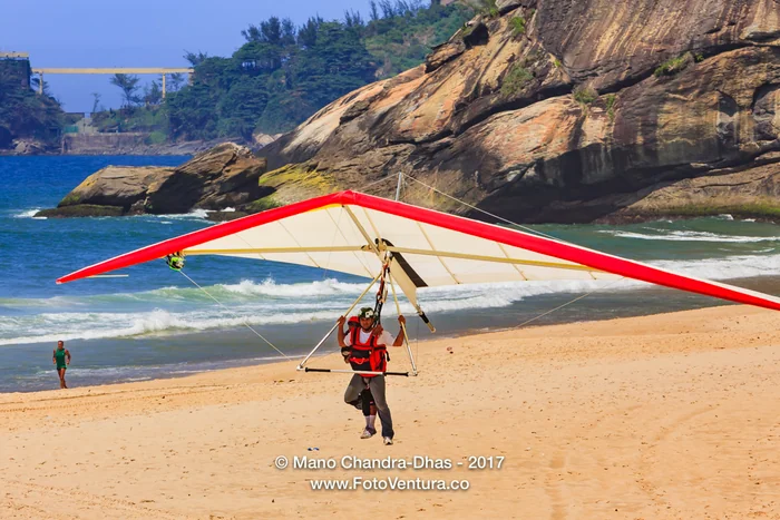 Rio de Janeiro, Brazil: Hang Glider landing on Sao Conrado