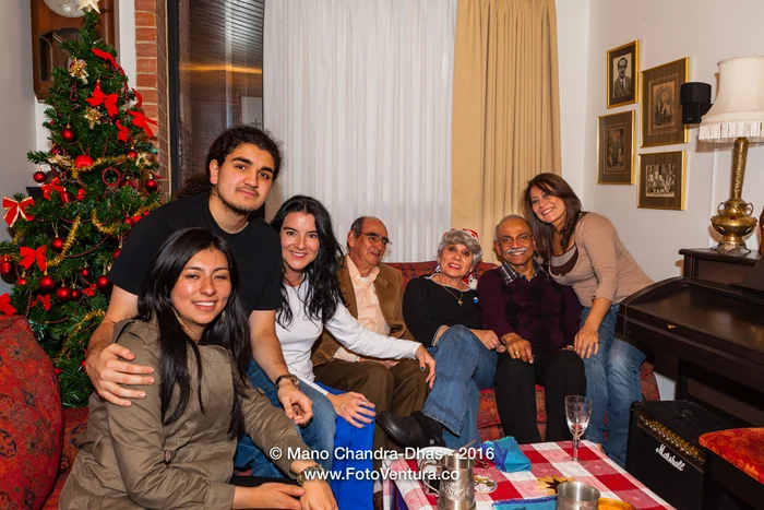 A family gathered in the living room at Christmas