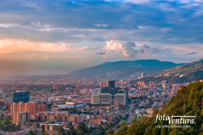 Bogota Colombia - It is late afternoon in the Northern part of the Capital city and District of Usaquén in Bogotá, Colombia, South America as viewed from the heights of La Calera on the Andes just before sunset time. The city at street level is located at an altitude of 8,660 feet above mean sea level. Downtown Usaquén with its modern office buildings can be clearly seen to the centre right of image. Horizontal format; copy space.