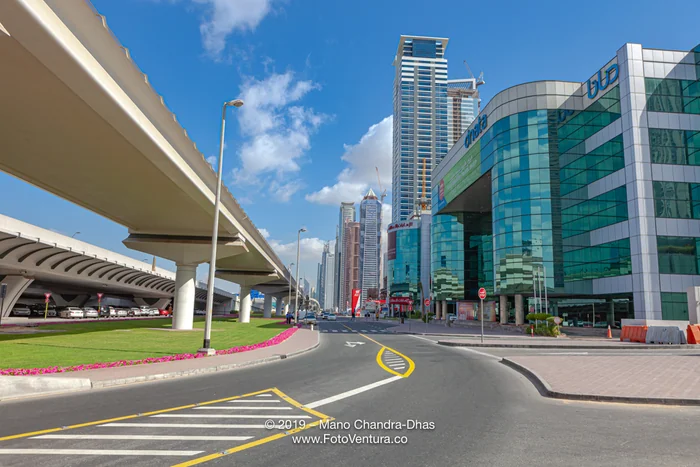 Dubai, United Arab Emirates - Elevated Railway Track To The Left And Modern Skyscrapers To The Right, Where Once Was Only Sand And A Desert Road.