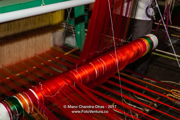 Kanchipuram, Tamil Nadu, India - Brightly Coloured Silk Thread Going Through a Handloom