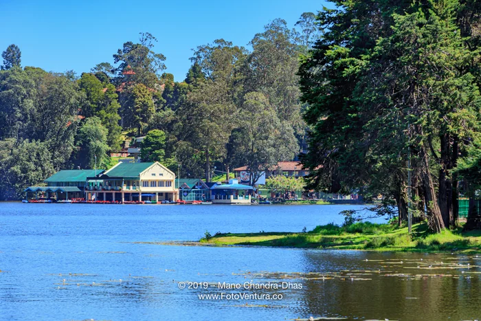 Kodaikanal, South India - Looking Across Kodaikanal Lake Towards The Boathouse, On The Palni Hills, In The Colonial Town In The State Of Tamil Nadu, In The Morning Sunlight; Copy Space.