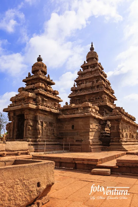 Mahabalipuram, India - Gopuram Of The Pallava 8th Century Shore Temple Against A Blue Sky