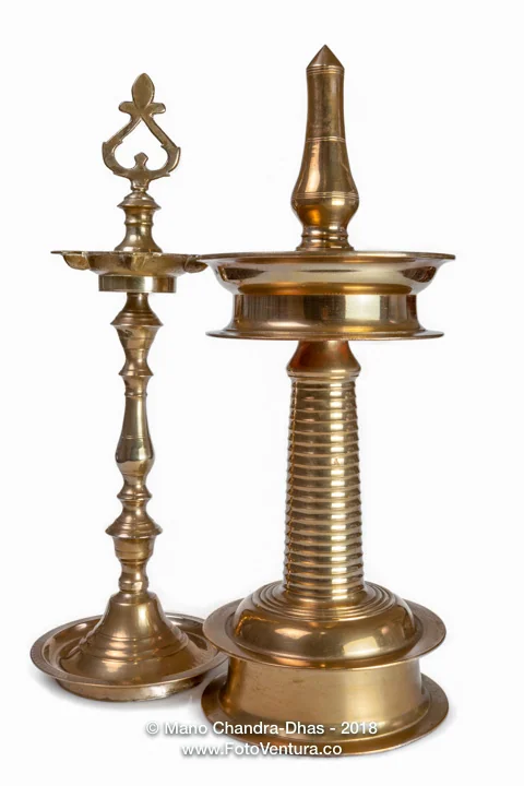 Two Traditional Ceremonial Bronze Oil Lamps From South India Isolated on White Background © Devasahayam Chandra Dhas