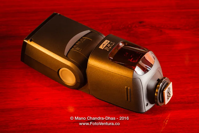 Metz 52 AF-1 Flash on rosewood table