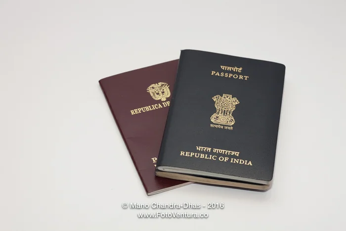 Indian and Colombian passports on a white background