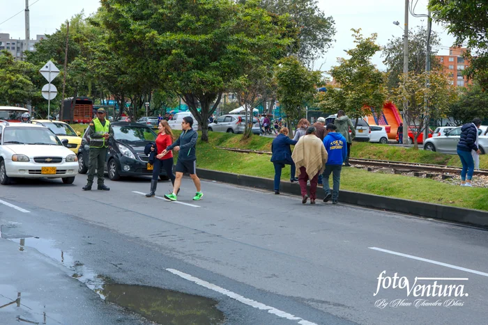 Colombia - The Historic Peace Referendum - A Policeman has Stopped Traffic on Carrera Novena to Facilitate Voters