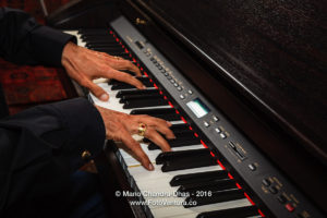 Male Asian Hands on Digital Piano Keyboard