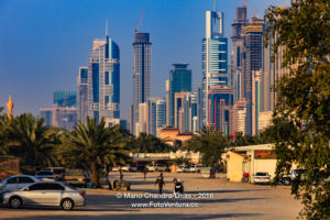 Dubai, UAE - Skyscrapers on Sheikh Zayed Road; Desert Foreground