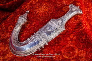 Arabian Silver Dagger against Red Fabric
