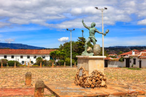 Colombia, South America - The Parque Ricaurte in the Historic 16th Century Andean Town Of Villa de Leyva, With The Statue Of The Martyr In The Centre Of the Square, In The Morning Sunlight