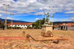 Colombia, South America - The Parque Ricaurte in the Historic 16th Century Andean Town Of Villa de Leyva, With The Statue Of The Martyr In The Centre Of the Square, In The Morning Sunlight