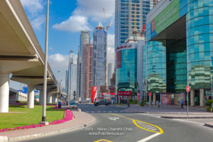 Dubai, United Arab Emirates - Elevated Railway Track To The Left And Modern Skyscrapers To The Right, Where Once Was Only Sand And A Desert Road.