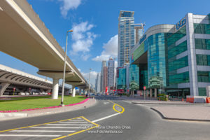 Dubai, United Arab Emirates - Elevated Railway Track To The Left And Modern Skyscrapers To The Right, Where Once Was Only Sand And A Desert Road.