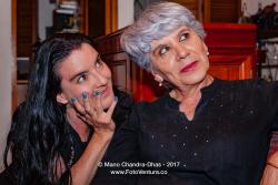 A Senior Silver Haired Latin Lady And Her Niece Listening Intently To The Story