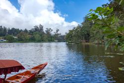 Kodaikanal, South India - Looking Across Kodaikanal Lake In The Colonial Town In The State Of Tamil Nadu; A Boat Used To Row Tourists Around The Lake Is Seen To The Lower Left.