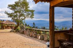 Colombia, South America - Roadside View Of The Andes Mountains At About 10,000 Feet Above Mean Sea Level; Rustic Roadside Seats To Enjoy The Andean View; Nature Background
