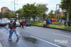 Colombia - The Historic Peace Referendum - A Policeman has Stopped Traffic on Carrera Novena to Facilitate Voters Crossing the Road