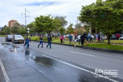 Colombia - The Historic Peace Referendum - A Policeman has Stopped Traffic on Carrera Novena to Facilitate Voters Crossing the Road