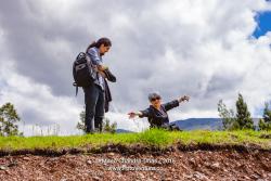 Latin Lady With Silver Hair Expresses Joy In The Beauty Of Nature In the Tranquil Surroundings The Andes Mountains