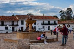Colombia, South America - People By The Fountain On Main Plaza In 16th Century Villa de Leyva
